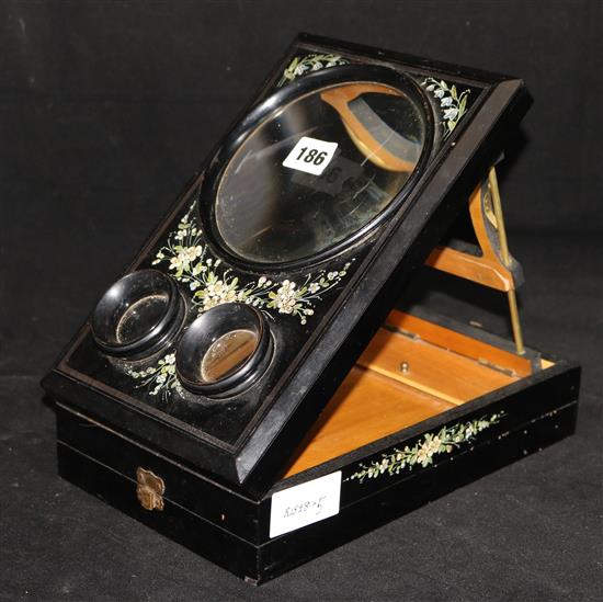 An ebonised stereoscope and postcard viewer